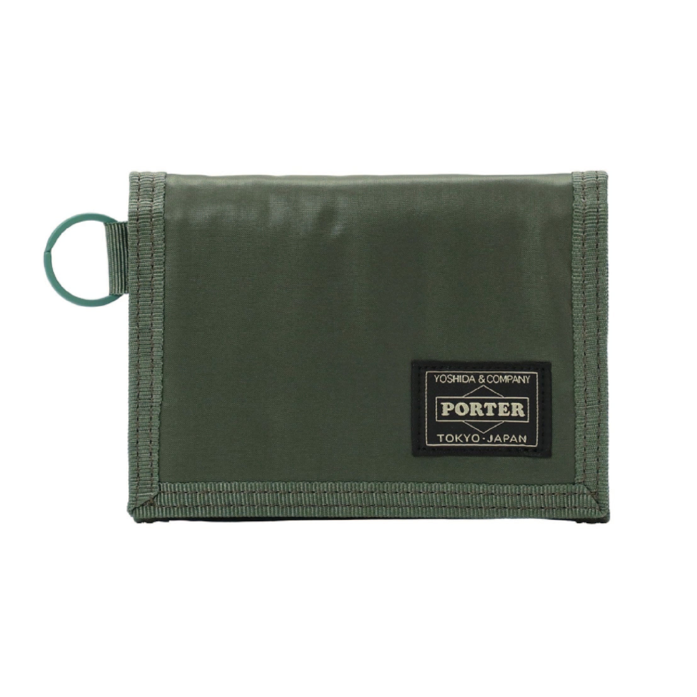Porter Yoshida & Co. Capsule Wallet in khaki — front view showing compact zip-around form and embossed Porter branding