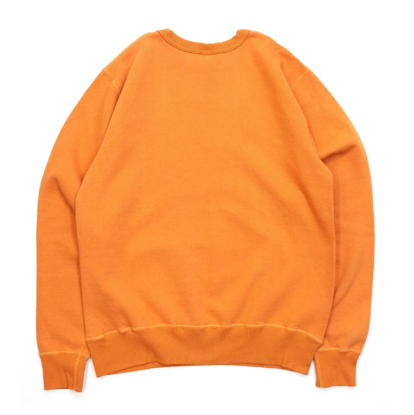 Detailed view of Buzz Rickson's orange sweatshirt's ribbed crew neck and cuffs.