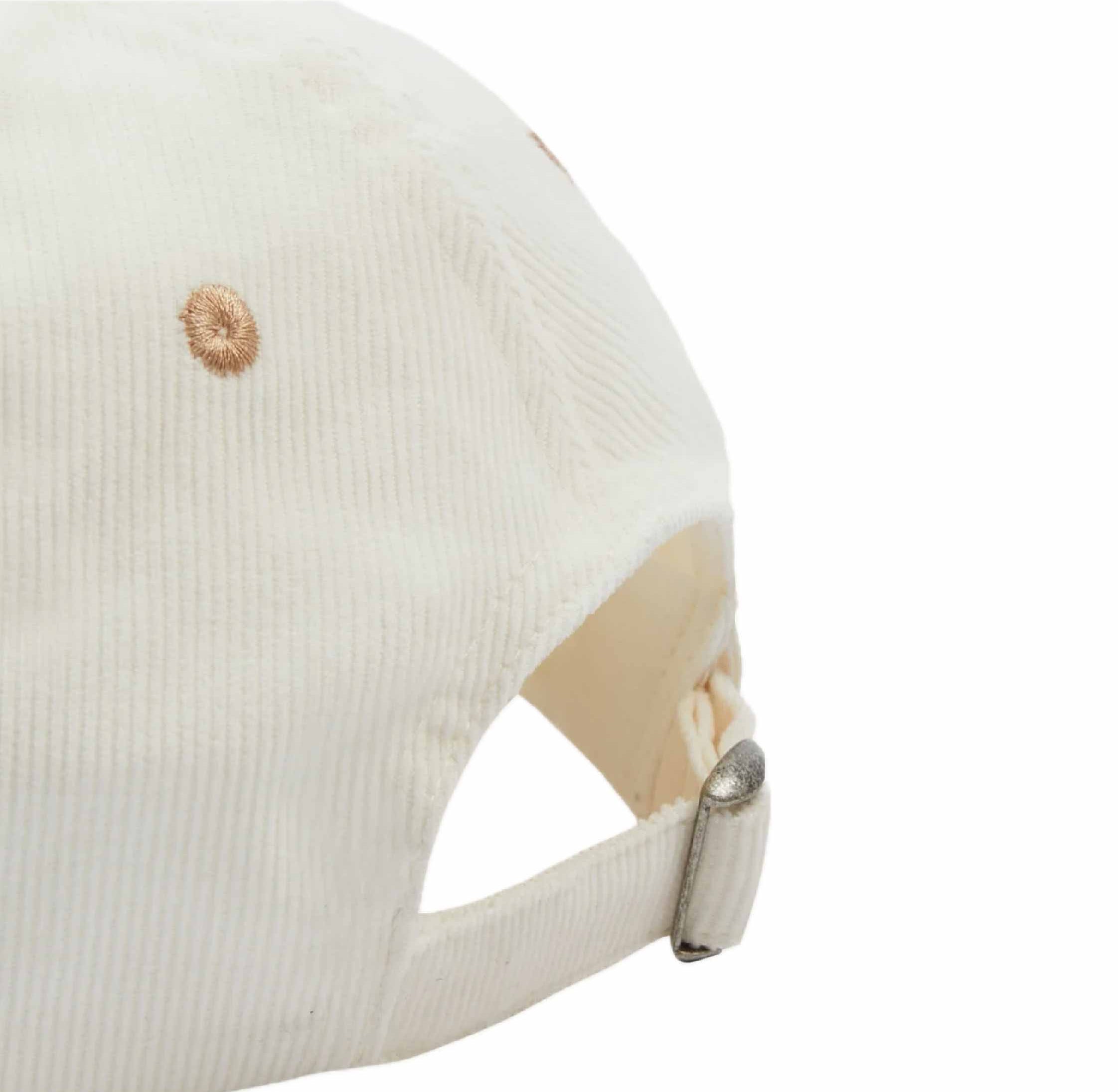 Side view of Ecru Motel Cotton Corduroy Cap from Drake's, showcasing detailed craftsmanship.